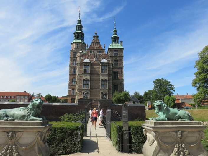 Rosenborg Castle seen from Kongens Have, Copenhagen, Denmark. There are two Lion Sculptures in the foreground
