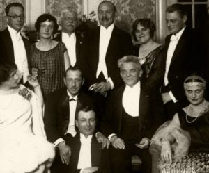 The Danish composer Carl Nielsen at a party for Igor Stravinsky sitting by his side