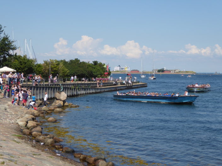Tour boats and tourists at The Little Mermaid, Copenhagen, Denmark