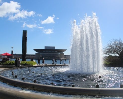 The fountain in Amaliehaven in Copenhagen, Denmark with the Opera House in the background across the water